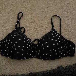 white polka-dot bathing suit top.